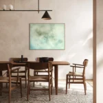 světle modrý abstraktní obraz pověšený za stolem na zdi